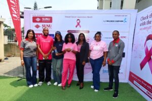 R-L: Mr. Samuel Olayemi, Brand and Corporate Communications, SUNU Health Nigeria Limited; a representative of Pearl Oncology; Mrs. Japari Yusuf, Head of Corporate Services, SUNU Assurances Nigeria Plc; Ms. Janet Karz Joshua, Convener, H2O Wellness Foundation; a representative of Aquacy Water; Mr. Francis Chinazor, Campaign Manager, H2O Wellness Foundation; and Ms. Ijeoma Nathaniel, Brand Communications Officer, SUNU Assurances Nigeria Plc, at the Pink Mic 2026 event held on Wednesday, October 28, 2026, at HealthRite Medical & Wellness Centre, Lekki, Lagos.